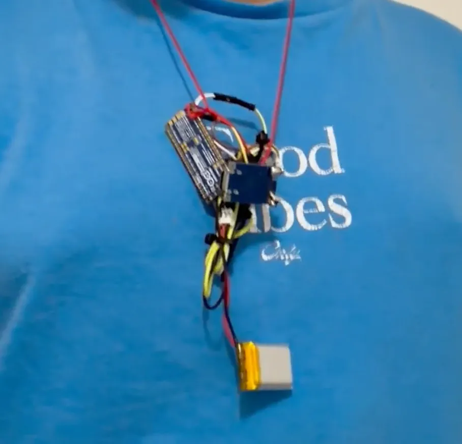 The Attune prototype worn as a necklace: an Arduino board, a sensor module, and a small battery hanging on a cord.